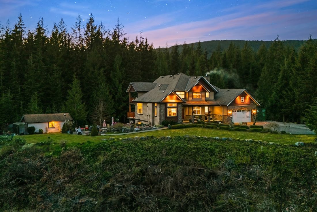 Aerial twilight view of the estate and lit workshop on 2.84 acres