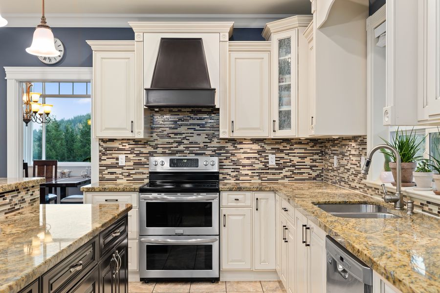 Kitchen with granite counters and tile backsplash